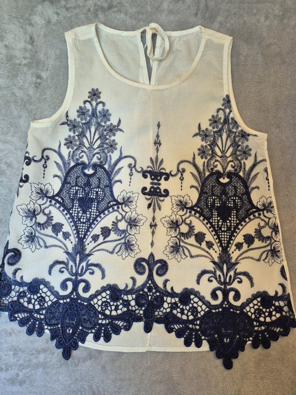 Embroidered Sleeveless Blouse with Lace Hem